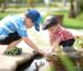Children playing with portable outdoor toys in a park