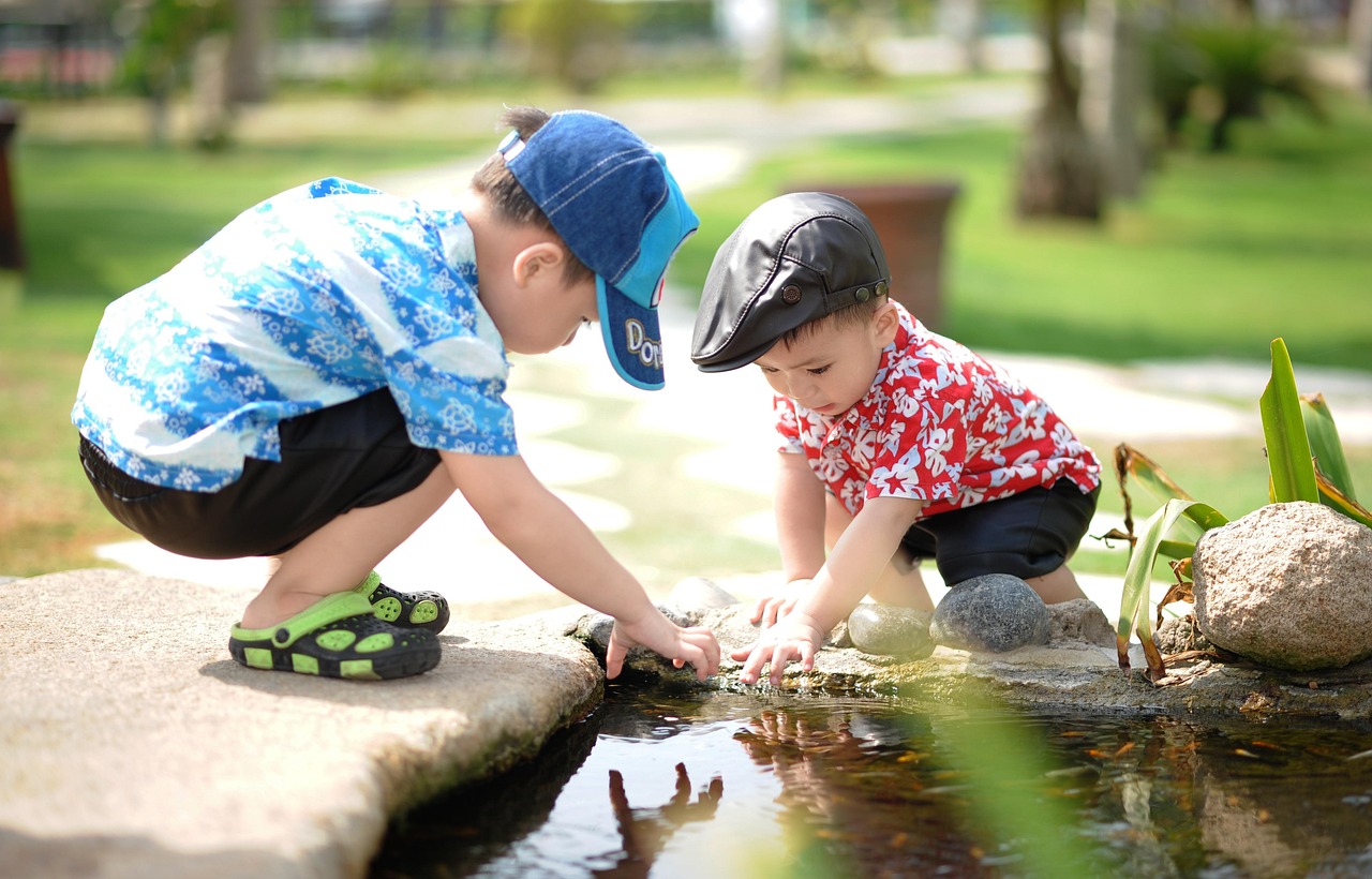 Children playing with portable outdoor toys in a park