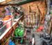 Outdoor play equipment covered and stored beside a shed