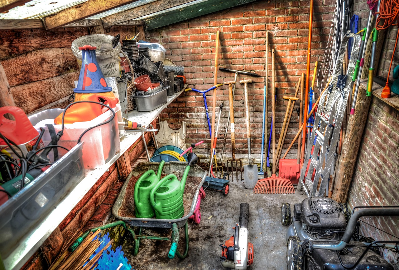Outdoor play equipment covered and stored beside a shed